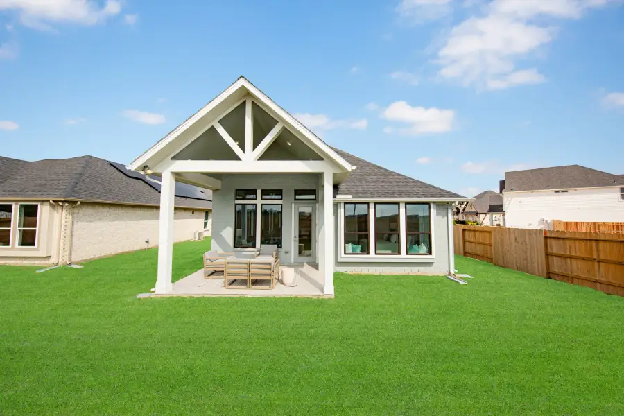 Exterior details and patio area of a home in Ellwood, Iowa Colony (Image 4).