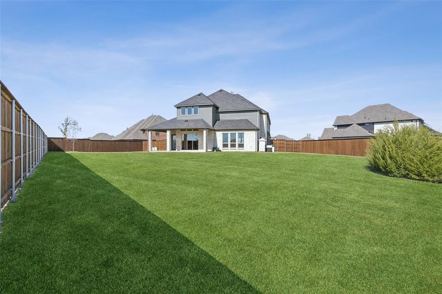 Exterior details and patio area of a home in Cambridge Estates, Prosper (Image 22). Exterior details and patio area of a home in Cambridge Estates, Prosper (Image 22).