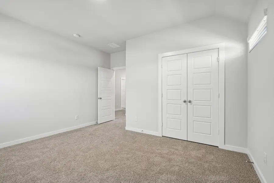 Bedroom in the Wimbledon home plan by Trophy Signature Homes