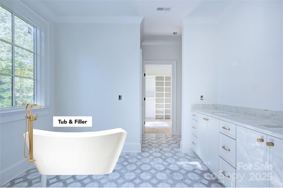 Primary bathroom with walk in closet in view Primary bathroom with walk in closet in view