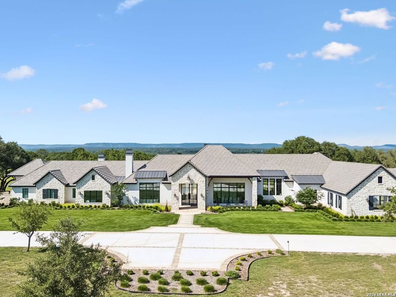 Front exterior of a new home in , Boerne, TX, highlighting curb appeal (Image 25).