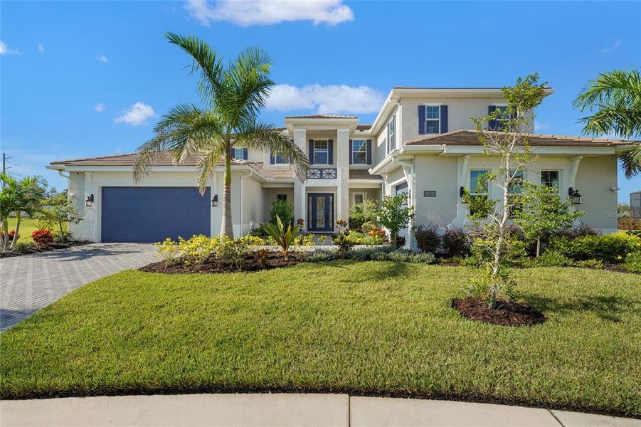 Front exterior of a new home in , Lakewood Ranch, FL, highlighting curb appeal (Image 19).