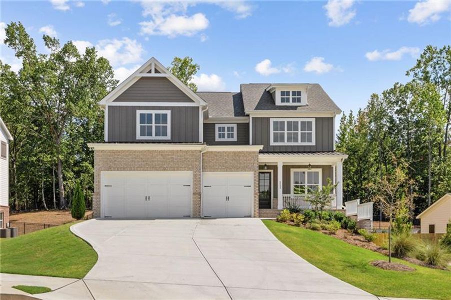 Front exterior of a new home in Arden on Lanier, Cumming, GA, highlighting curb appeal (Image 2). Front exterior of a new home in Arden on Lanier, Cumming, GA, highlighting curb appeal (Image 2).