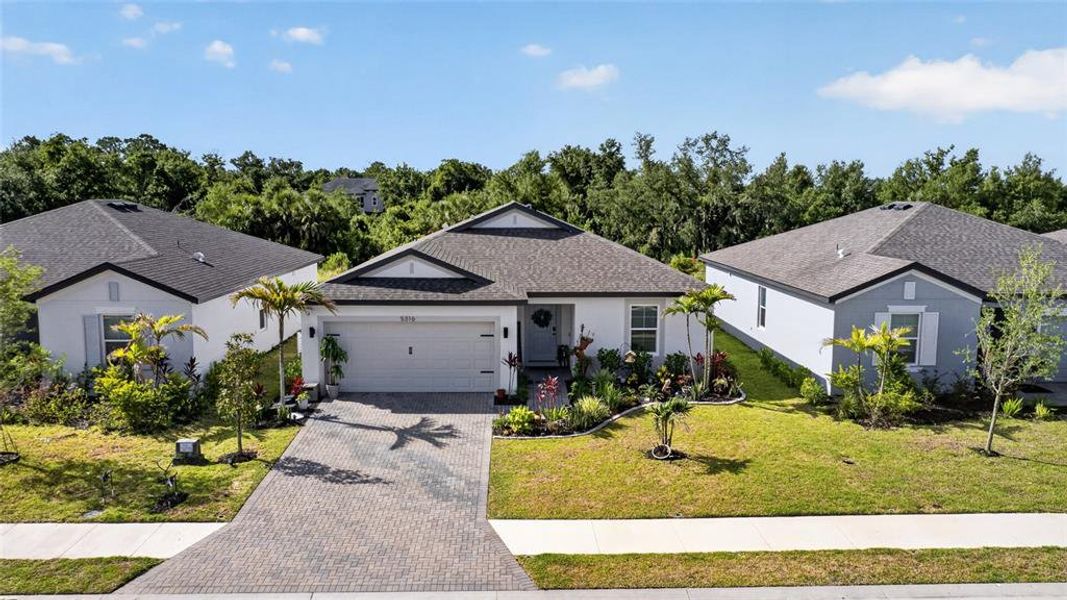 Front exterior of a new home in , Palmetto, FL, highlighting curb appeal (Image 25). Front exterior of a new home in , Palmetto, FL, highlighting curb appeal (Image 25).