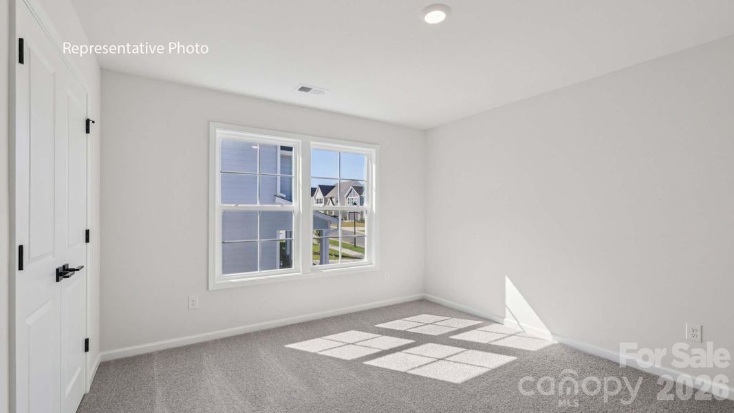 Spacious, unfurnished interior of a new home in Sanctuary at Southgate, Indian Trail (Image 14).