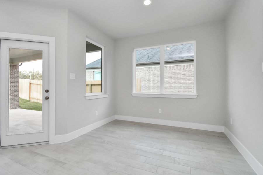 Enjoy breakfast with ease in the connected and cozy breakfast area, seamlessly integrated with the kitchen for utmost convenience. Step through the back door for a breath of fresh air onto the covered patio, extending your living space to the outdoors. Sample photo of completed home with similar floor plan. Actual colors and selections may vary. Enjoy breakfast with ease in the connected and cozy breakfast area, seamlessly integrated with the kitchen for utmost convenience. Step through the back door for a breath of fresh air onto the covered patio, extending your living space to the outdoors. Sample photo of completed home with similar floor plan. Actual colors and selections may vary.