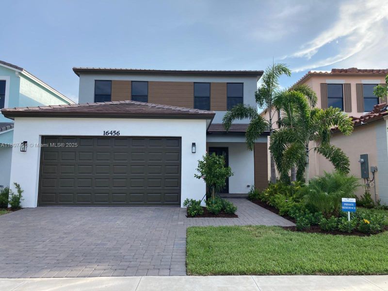 Front exterior of a new home in , Westlake, FL, highlighting curb appeal (Image 20).