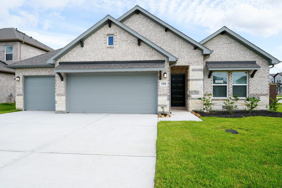 Front exterior of a new home in Foxtail Palms, Manvel, TX, highlighting curb appeal (Image 22).