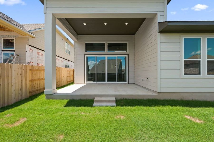 Exterior details and patio area of a home in Lariat, Liberty Hill (Image 29).