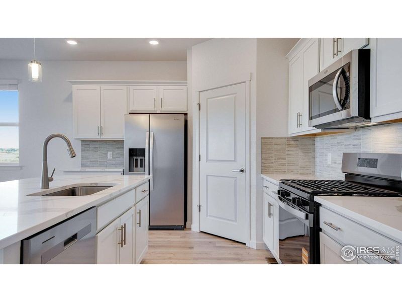 Furnished interior view inside a new home in Vantage, Berthoud (Image 3). Furnished interior view inside a new home in Vantage, Berthoud (Image 3).
