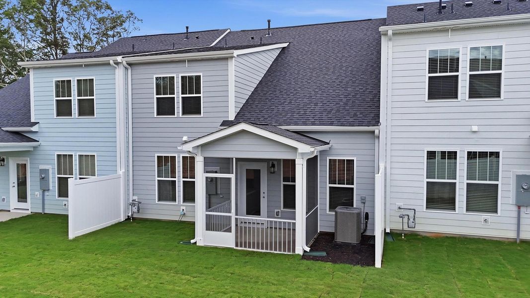 Established charm meets functional outdoor living with a spacious screened-in porch at Village at Midway