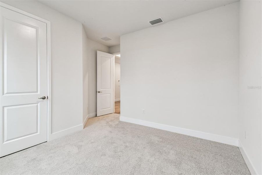 Spacious, unfurnished interior of a new home in The Peninsula at Rhodine Lake, Riverview (Image 38).