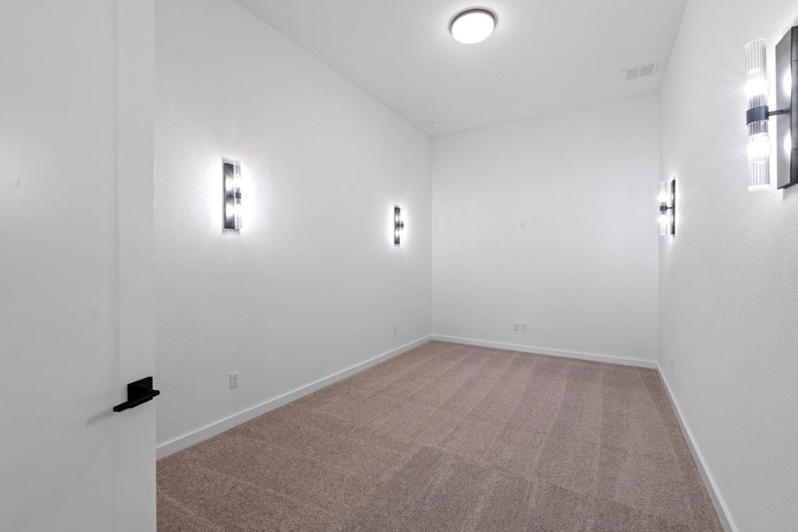 Unfurnished room with light colored carpet and baseboards