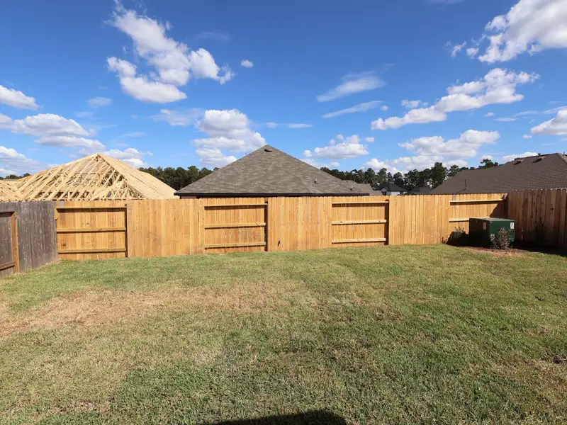 Exterior details and patio area of a home in Magnolia Ridge, Magnolia (Image 3).