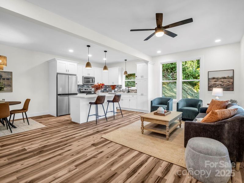 Looking from front door into open floor plan (living, dining area and kitchen)