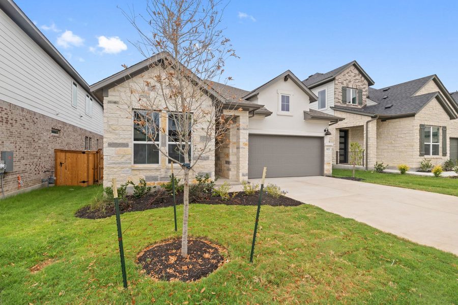 Front exterior of a new home in Heritage, Dripping Springs, TX, highlighting curb appeal (Image 25).