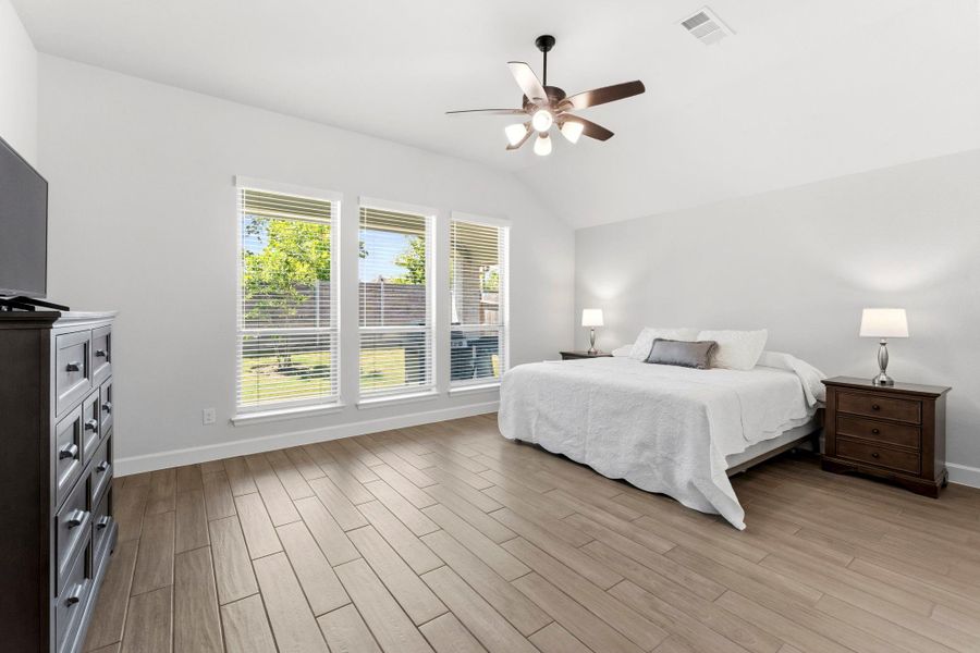 Primary Suite w/High Ceilings, Ceiling Fan, Views of Rear Covered Patio and Yard w/Privacy Primary Suite w/High Ceilings, Ceiling Fan, Views of Rear Covered Patio and Yard w/Privacy