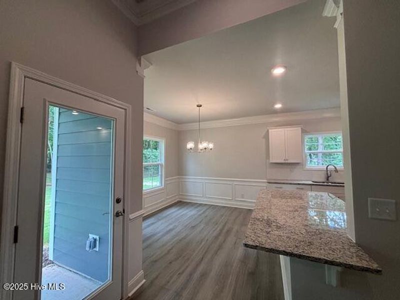 Furnished interior view inside a new home in River Village Square in River Landing, Wallace (Image 5).