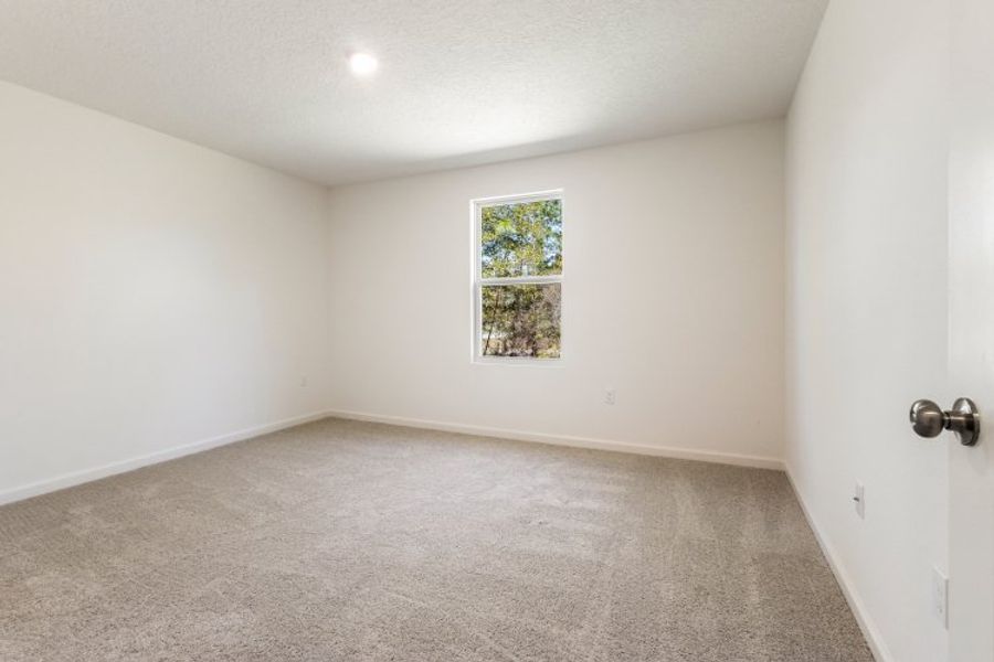 A room with a window and a door. A room with a window and a door.