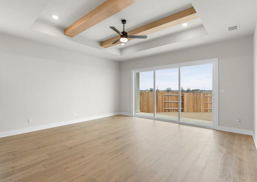 The living room has large windows that let in great, natural light.