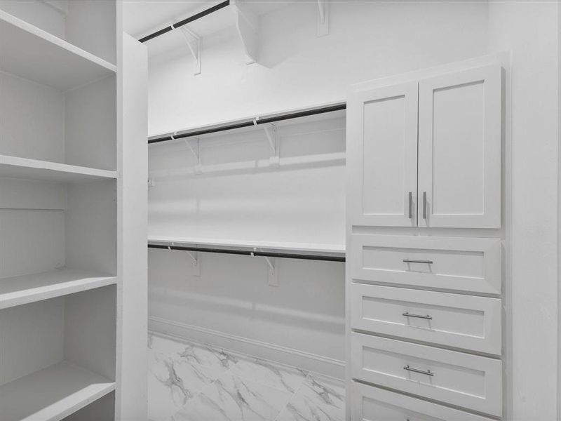 Spacious closet with marble finish flooring