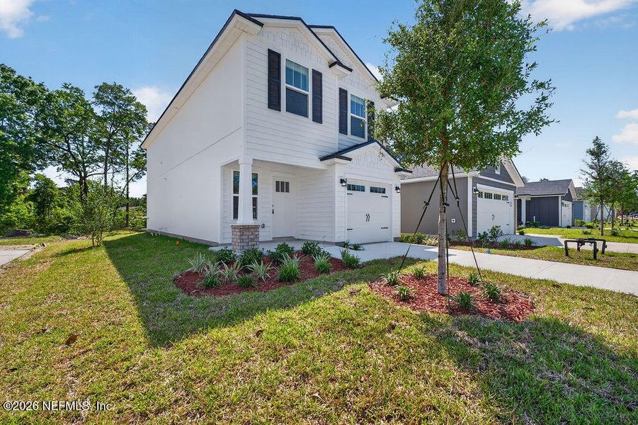 Front exterior of a new home in , Jacksonville, FL, highlighting curb appeal (Image 25).