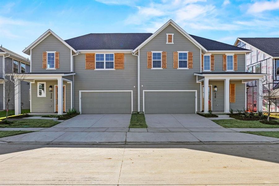 Front exterior of a new home in North Square at Uptown, Celina, TX, highlighting curb appeal (Image 1). Front exterior of a new home in North Square at Uptown, Celina, TX, highlighting curb appeal (Image 1).