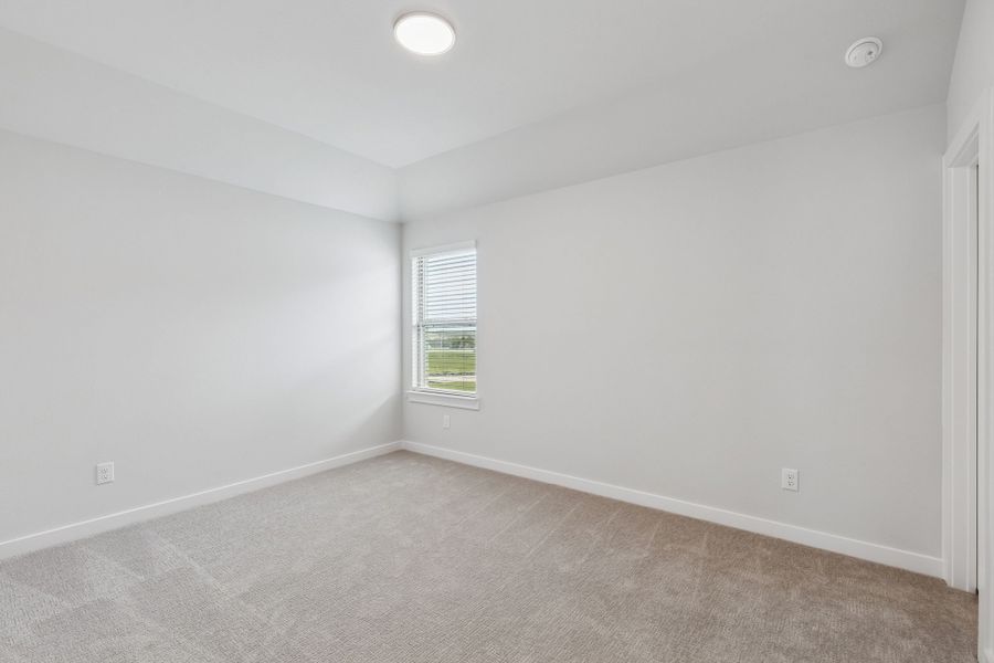 Bedroom in the Stanley II home plan by Trophy Signature Homes – REPRESENTATIVE PHOTO Bedroom in the Stanley II home plan by Trophy Signature Homes – REPRESENTATIVE PHOTO