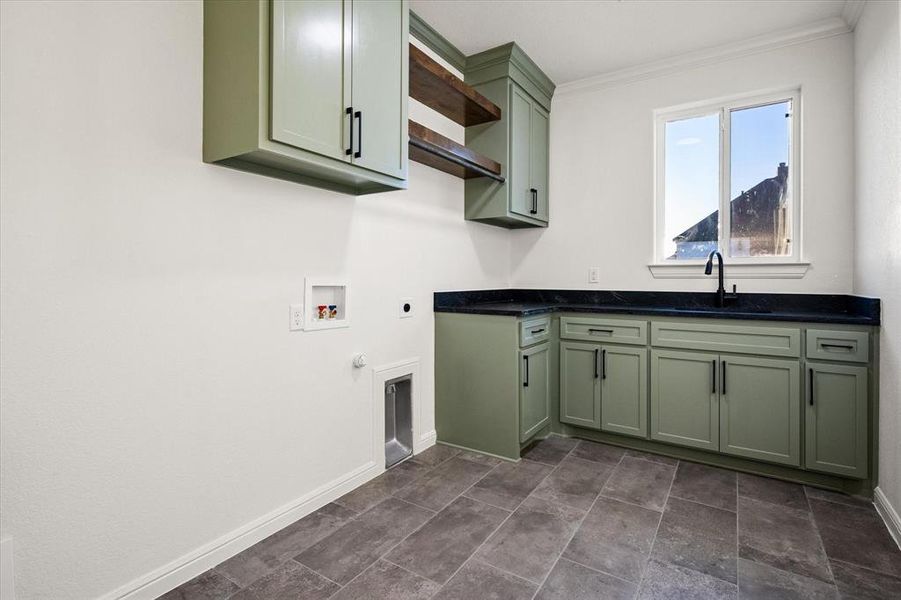 The perfect shade of green, floating shelves...laundry doesn't seem so bad!