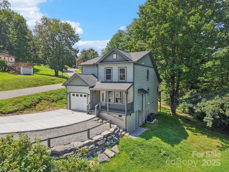 Front exterior of a new home in , Waynesville, NC, highlighting curb appeal (Image 28).