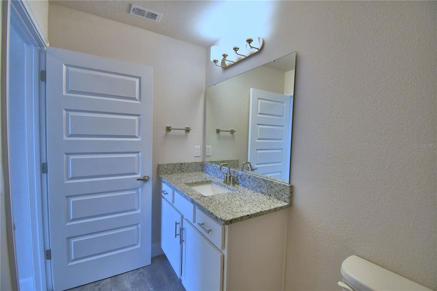 Furnished interior view inside a new home in Lake Juliana Estates, Auburndale (Image 1).