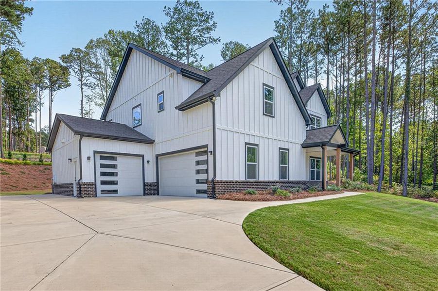 Front exterior of a new home in , Winder, GA, highlighting curb appeal (Image 26).