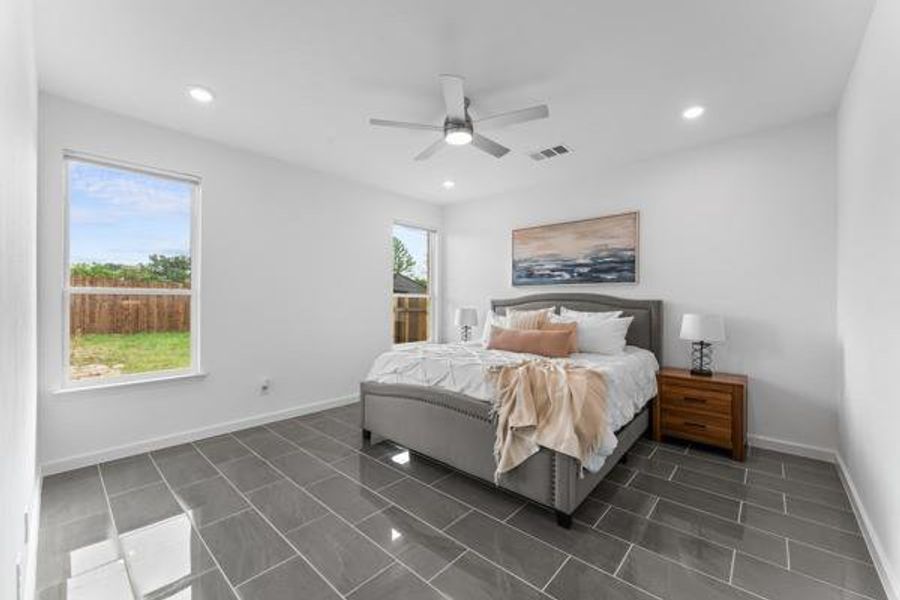 Bedroom featuring recessed lighting and a ceiling fan Bedroom featuring recessed lighting and a ceiling fan