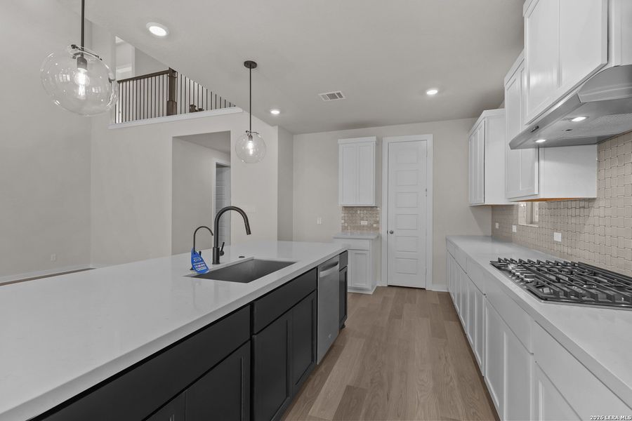 Furnished interior view inside a new home in Nopal Valley, San Antonio (Image 9).