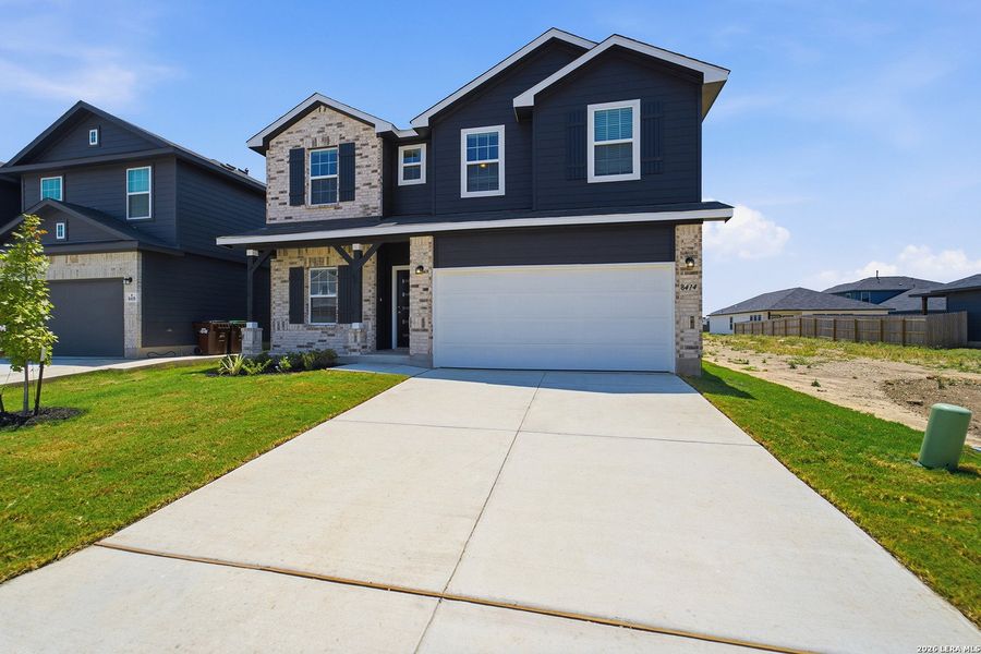 Front exterior of a new home in Red Hawk Landing, San Antonio, TX, highlighting curb appeal (Image 21).