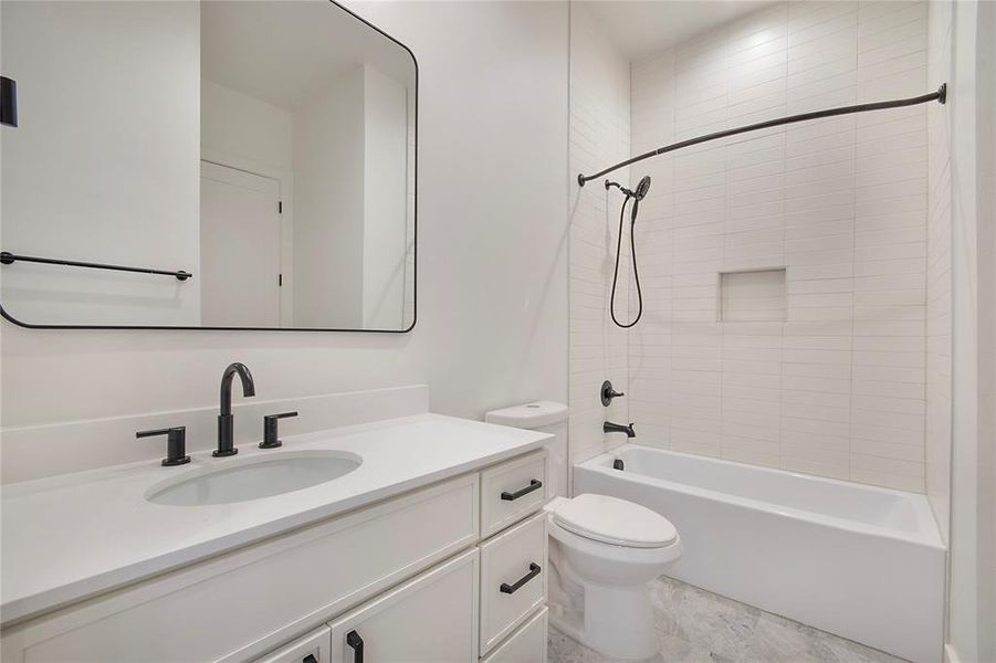 Bathroom featuring bathtub / shower combination and vanity Bathroom featuring bathtub / shower combination and vanity