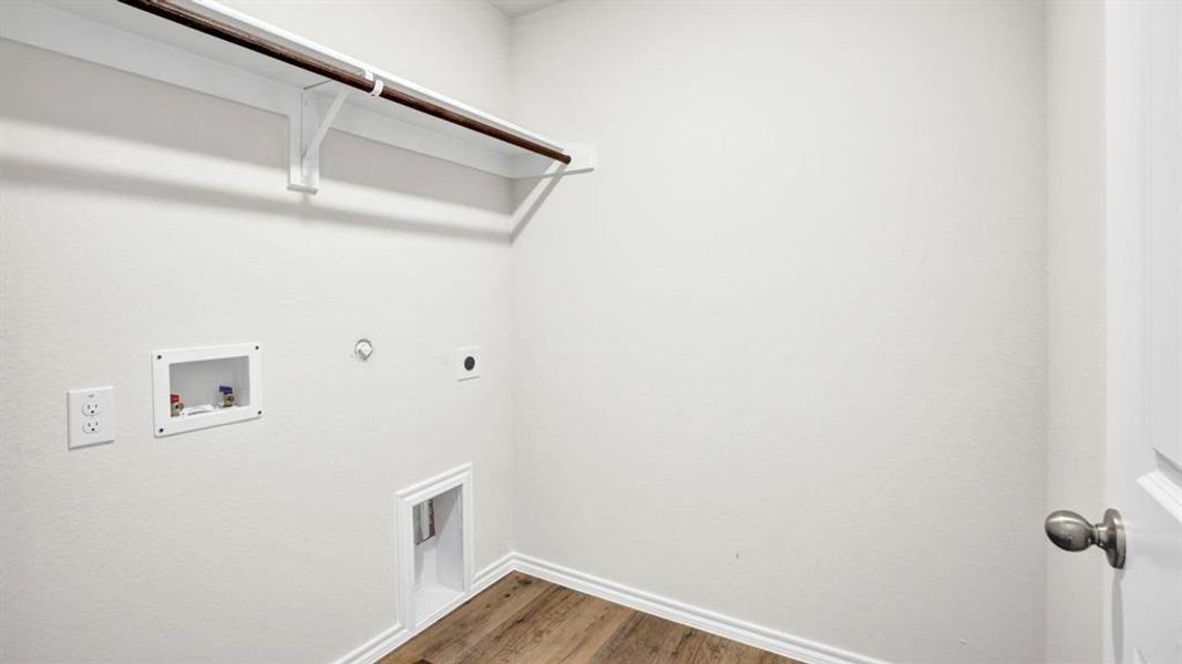 Laundry area featuring hookup for a gas dryer, dark wood-style floors, washer hookup, and hookup for an electric dryer