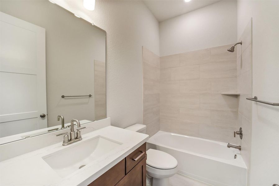 Furnished interior view inside a new home in Sunterra, Katy (Image 7).