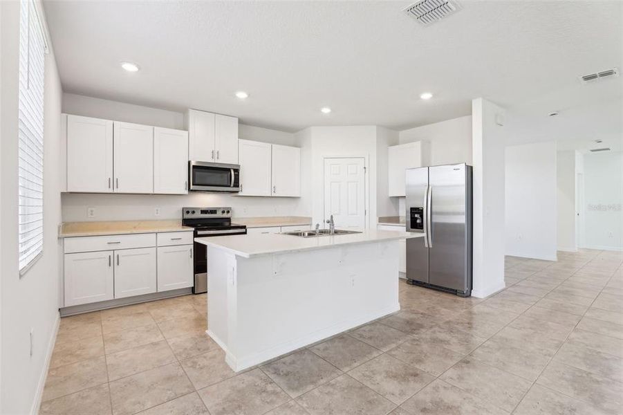 Furnished interior view inside a new home in Lake Deer Estates - Signature Series, Poinciana (Image 14). Furnished interior view inside a new home in Lake Deer Estates - Signature Series, Poinciana (Image 14).