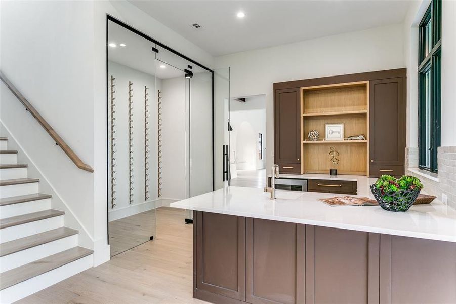 Game room with bar area and wine feature wall. Game room with bar area and wine feature wall.