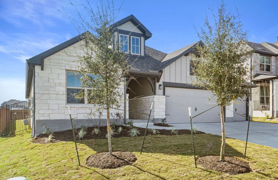 Front exterior of a new home in Saddleback at Santa Rita Ranch, Liberty Hill, TX, highlighting curb appeal (Image 21).