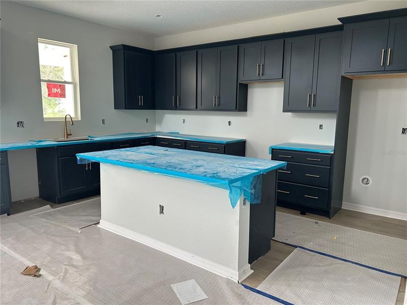 In-progress construction of a new home in Oakfield Trails Signature, Parrish, FL (Image 36).