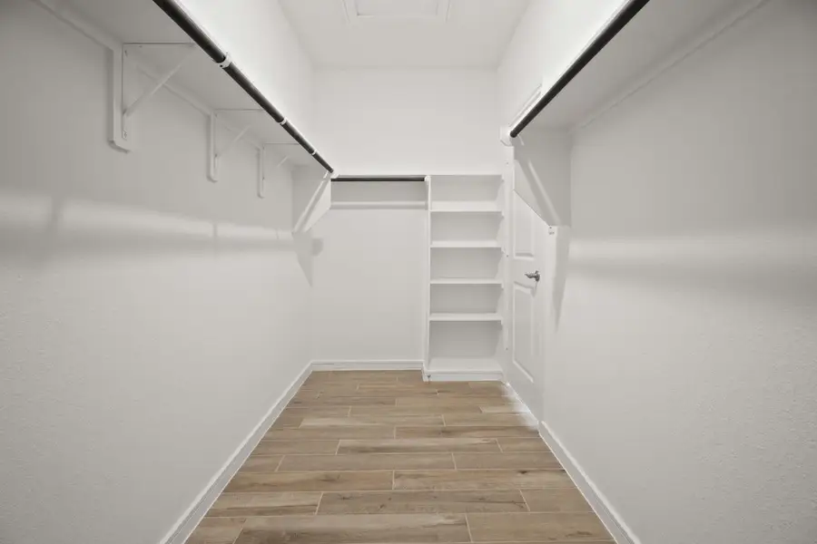 Large walk-in closet in the primary suite (*Photo not of actual home and used for illustration purposes only.) Large walk-in closet in the primary suite (*Photo not of actual home and used for illustration purposes only.)