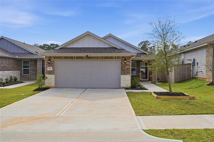 Front exterior of a new home in Montgomery Oaks - Premier, Conroe, TX, highlighting curb appeal (Image 23).