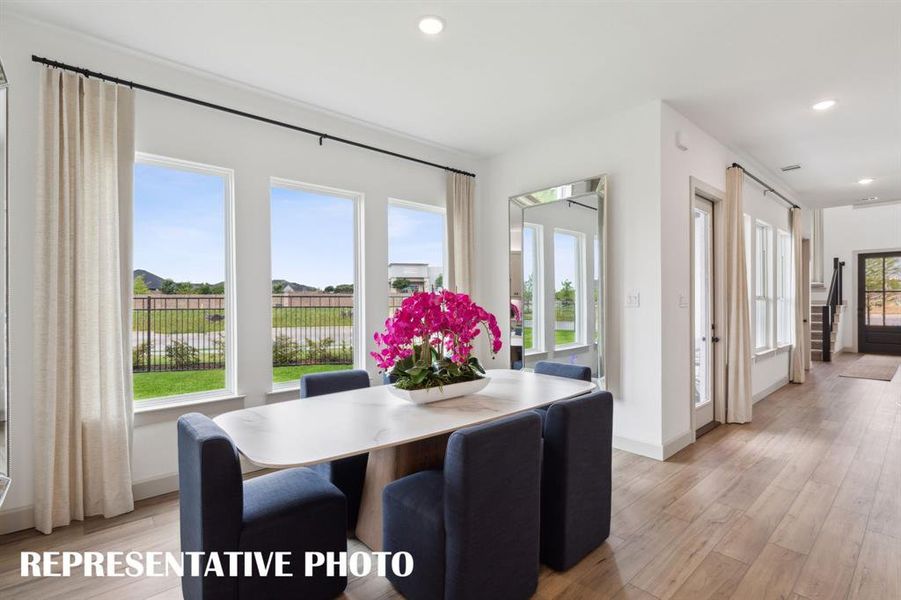 Whether it's grand dinner parties or cozy family meals, this light filled dining room is the perfect place for you to entertain.  REPRESENTATIVE PHOTO