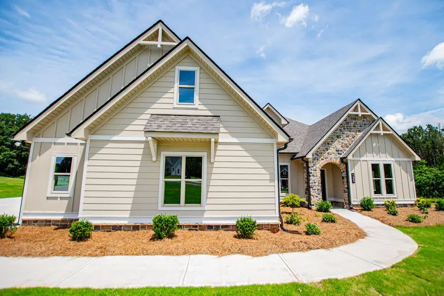 Front exterior of a new home in WOODMONT RESERVE, Roopville, GA, highlighting curb appeal (Image 30).