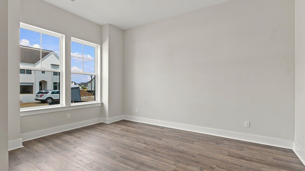 Two sizable windows allow for natural light into the living space.