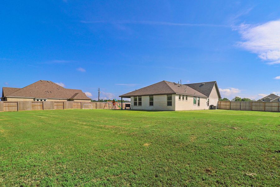 Front exterior of a new home in , Baytown, TX, highlighting curb appeal (Image 22). Front exterior of a new home in , Baytown, TX, highlighting curb appeal (Image 22).