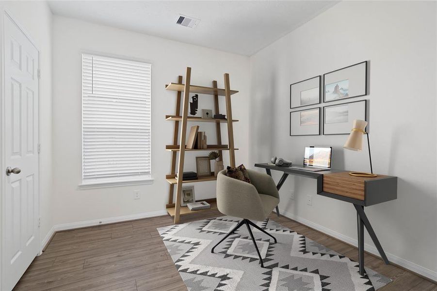 Quietly nestled in the home is the handsome den that can be used as an office, play room, or formal dining/living room. Featuring vinyl plank flooring, high ceilings, large window with privacy blinds and neutral paint.