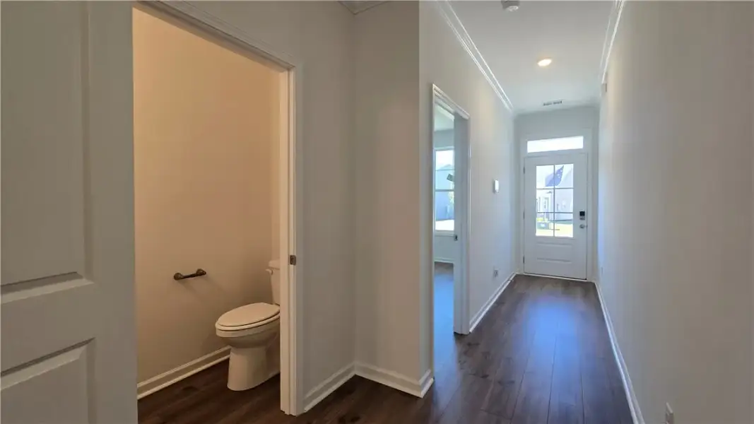 Rich wood-inspired floors and elegant crown moldin